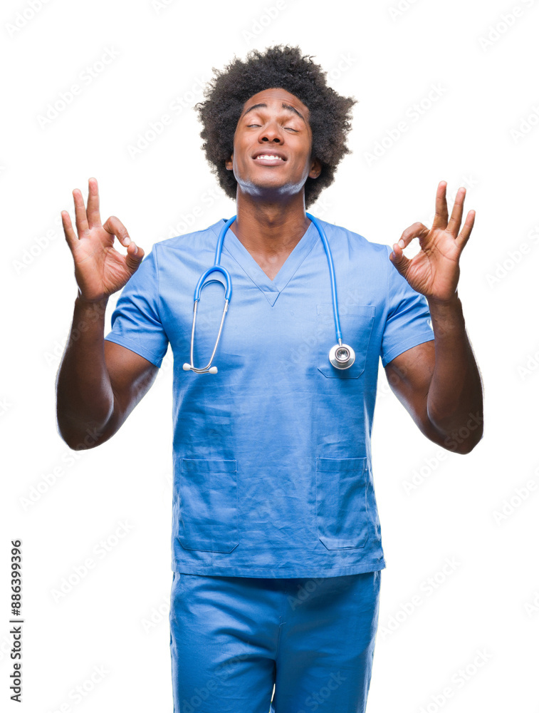 Afro american surgeon doctor man over isolated background relax and smiling with eyes closed doing meditation gesture with fingers. Yoga concept. Afro american surgeon doctor man over isolated background relax and smiling with eyes closed doing meditation gesture with fingers. Yoga concept.