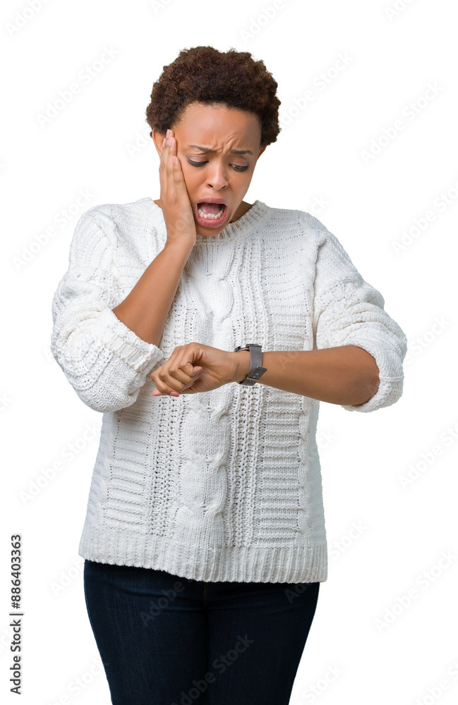 Beautiful young african american woman wearing sweater over isolated background Looking at the watch time worried, afraid of getting late