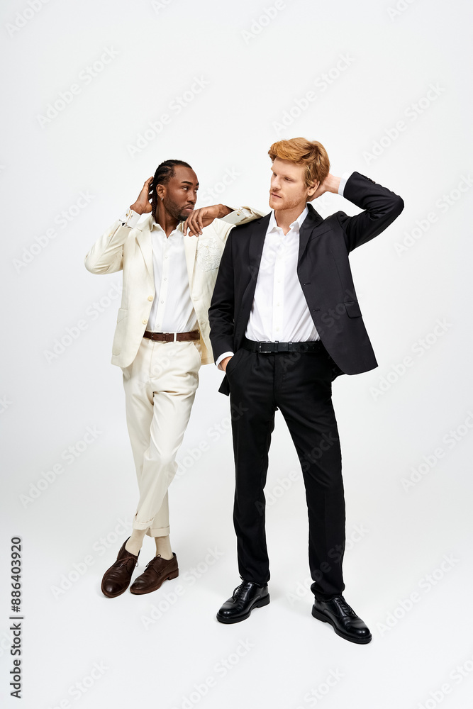 Handsome multicultural men in elegant suits posing together. Handsome multicultural men in elegant suits posing together.