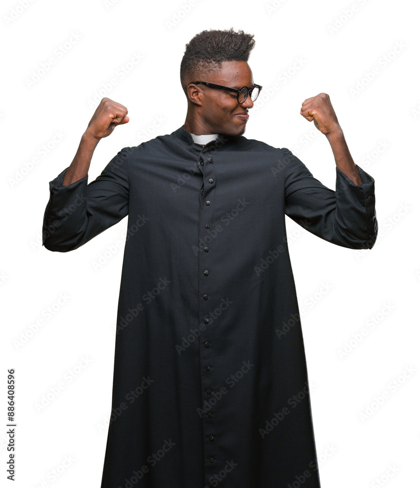 Young african american priest man over isolated background showing arms muscles smiling proud. Fitness concept. Young african american priest man over isolated background showing arms muscles smiling proud. Fitness concept.