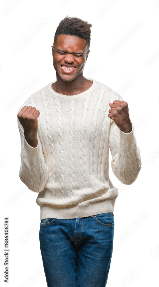 Young african american man over isolated background very happy and excited doing winner gesture with arms raised, smiling and screaming for success. Celebration concept.