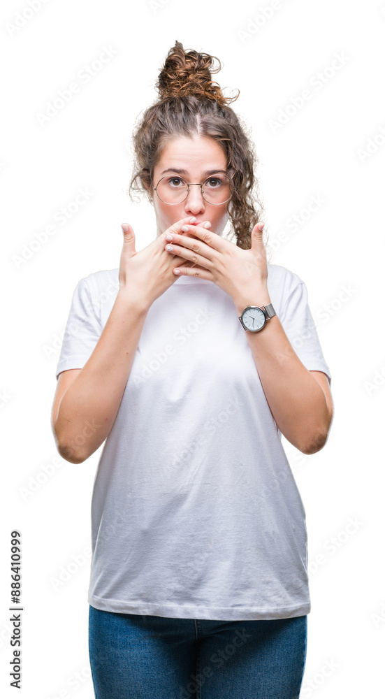 Beautiful young brunette curly hair girl wearing glasses over isolated background shocked covering mouth with hands for mistake. Secret concept. Beautiful young brunette curly hair girl wearing glasses over isolated background shocked covering mouth with hands for mistake. Secret concept.