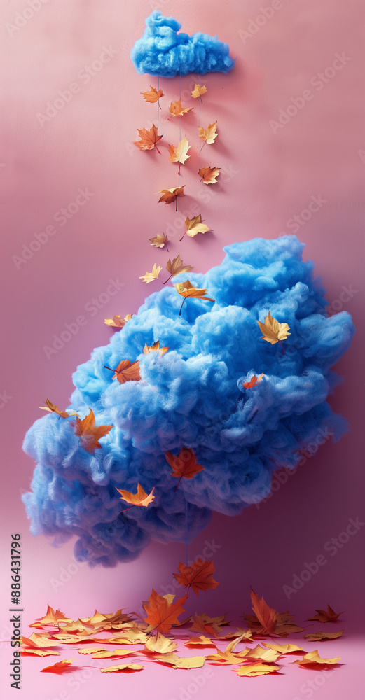 Fototapeta premium A blue cloud from which autumn leaves fall. Minimal autumn landscape