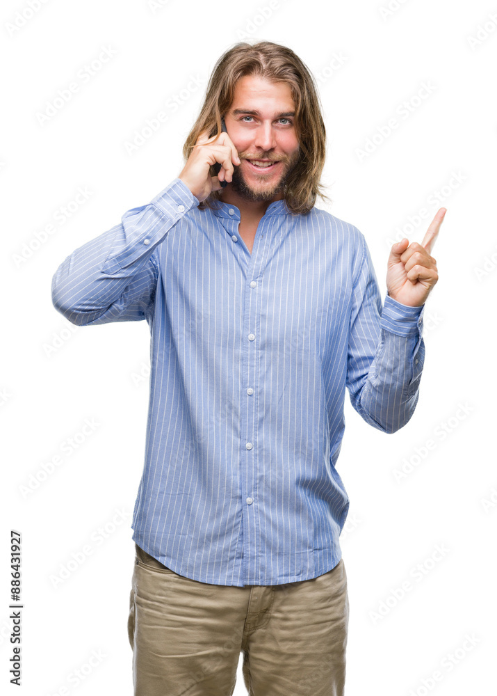 Young handsome man with long hair over isolated background talking on the phone very happy pointing with hand and finger to the side Young handsome man with long hair over isolated background talking on the phone very happy pointing with hand and finger to the side