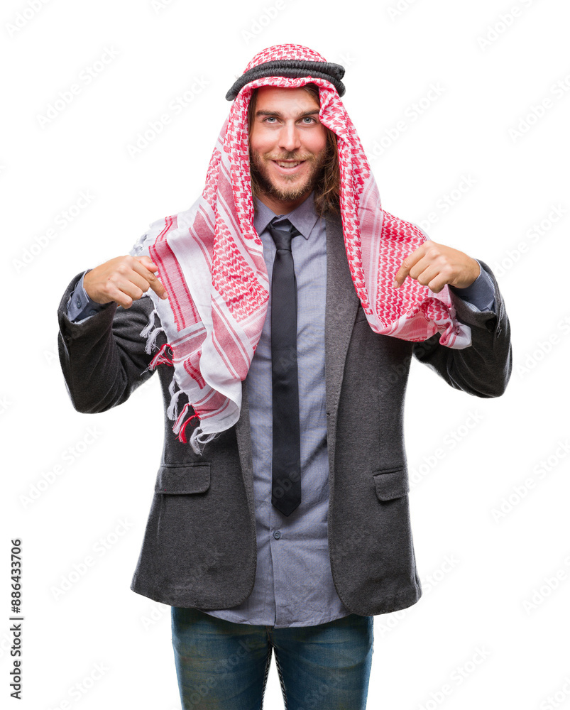 Young handsome arabian man with long hair wearing keffiyeh over isolated background looking confident with smile on face, pointing oneself with fingers proud and happy. Young handsome arabian man with long hair wearing keffiyeh over isolated background looking confident with smile on face, pointing oneself with fingers proud and happy.