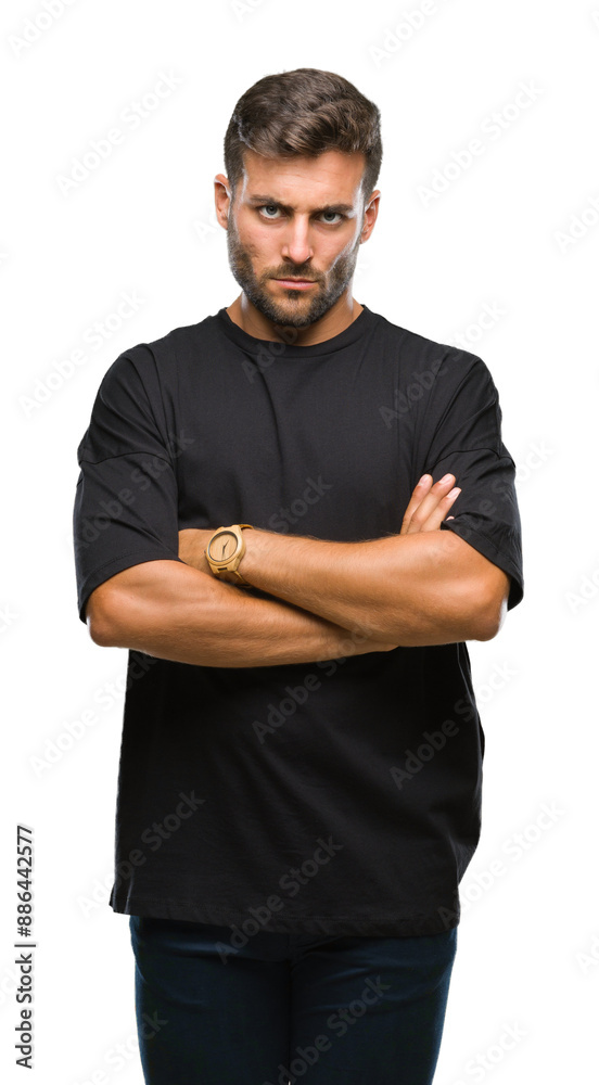 Fototapeta premium Young handsome man over isolated background skeptic and nervous, disapproving expression on face with crossed arms. Negative person.