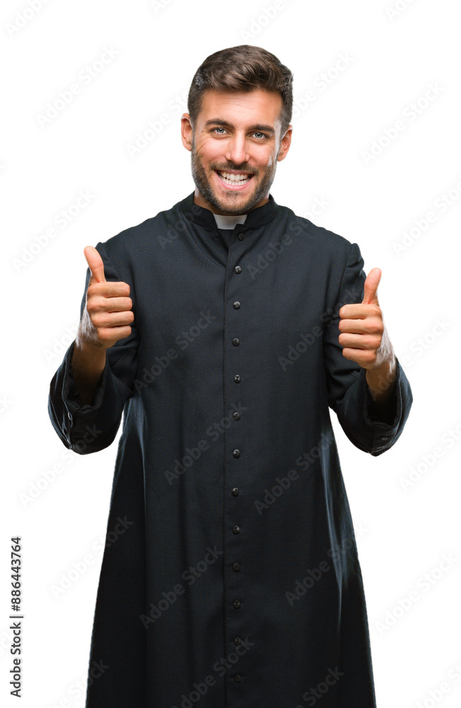 Young catholic christian priest man over isolated background success sign doing positive gesture with hand, thumbs up smiling and happy. Looking at the camera with cheerful expression, winner gesture. Young catholic christian priest man over isolated background success sign doing positive gesture with hand, thumbs up smiling and happy. Looking at the camera with cheerful expression, winner gesture.