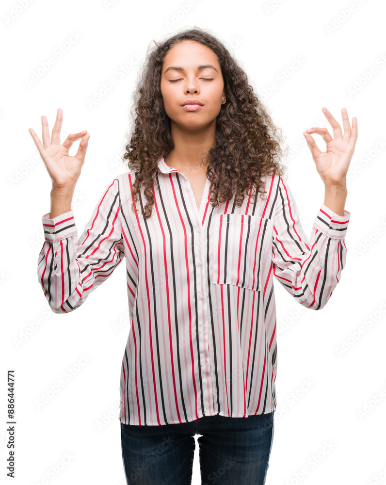 Beautiful young hispanic woman relax and smiling with eyes closed doing meditation gesture with fingers. Yoga concept. Beautiful young hispanic woman relax and smiling with eyes closed doing meditation gesture with fingers. Yoga concept.