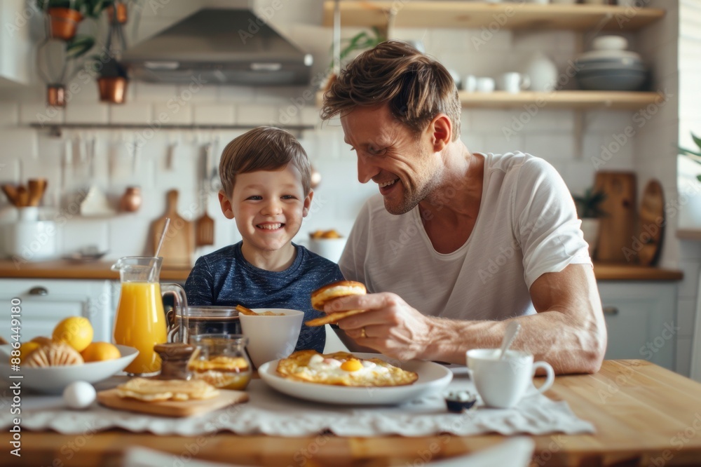 A happy father and son were having breakfast at home.