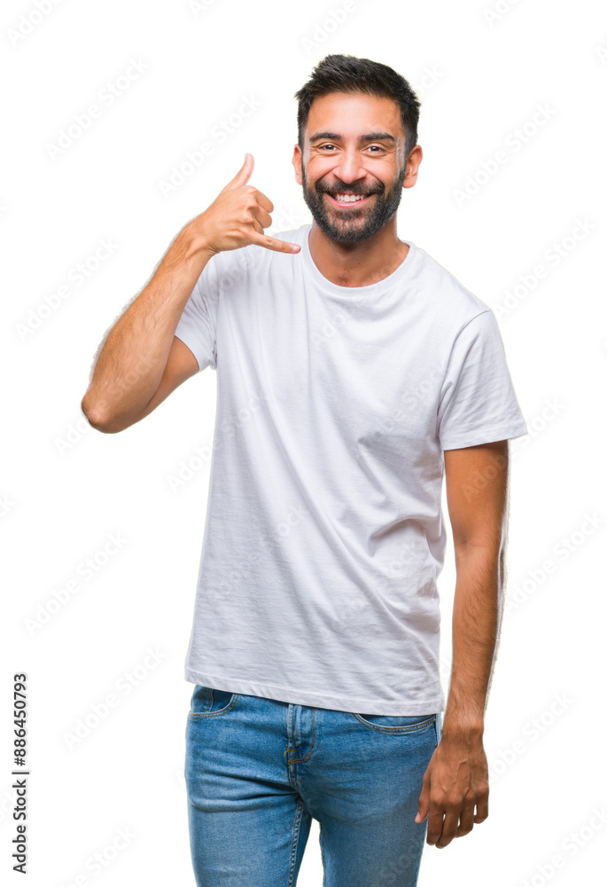 Fototapeta premium Adult hispanic man over isolated background smiling doing phone gesture with hand and fingers like talking on the telephone. Communicating concepts.