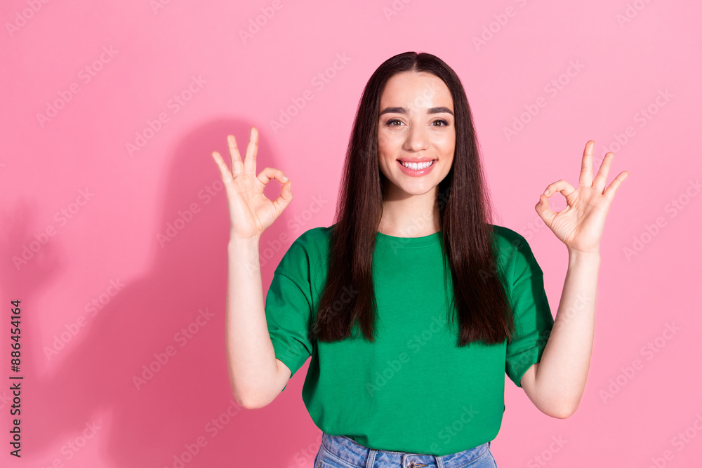 Photo of cheerful pretty lady dressed green t-shirt showing two okey gestures empty space isolated pink color background Photo of cheerful pretty lady dressed green t-shirt showing two okey gestures empty space isolated pink color background