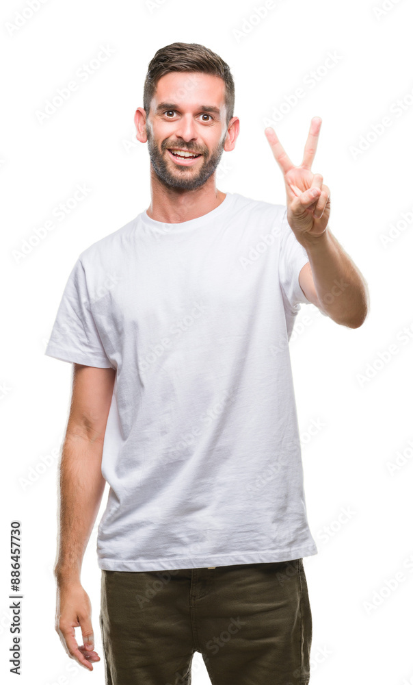 Young handsome man over isolated background smiling looking to the camera showing fingers doing victory sign. Number two. Young handsome man over isolated background smiling looking to the camera showing fingers doing victory sign. Number two.