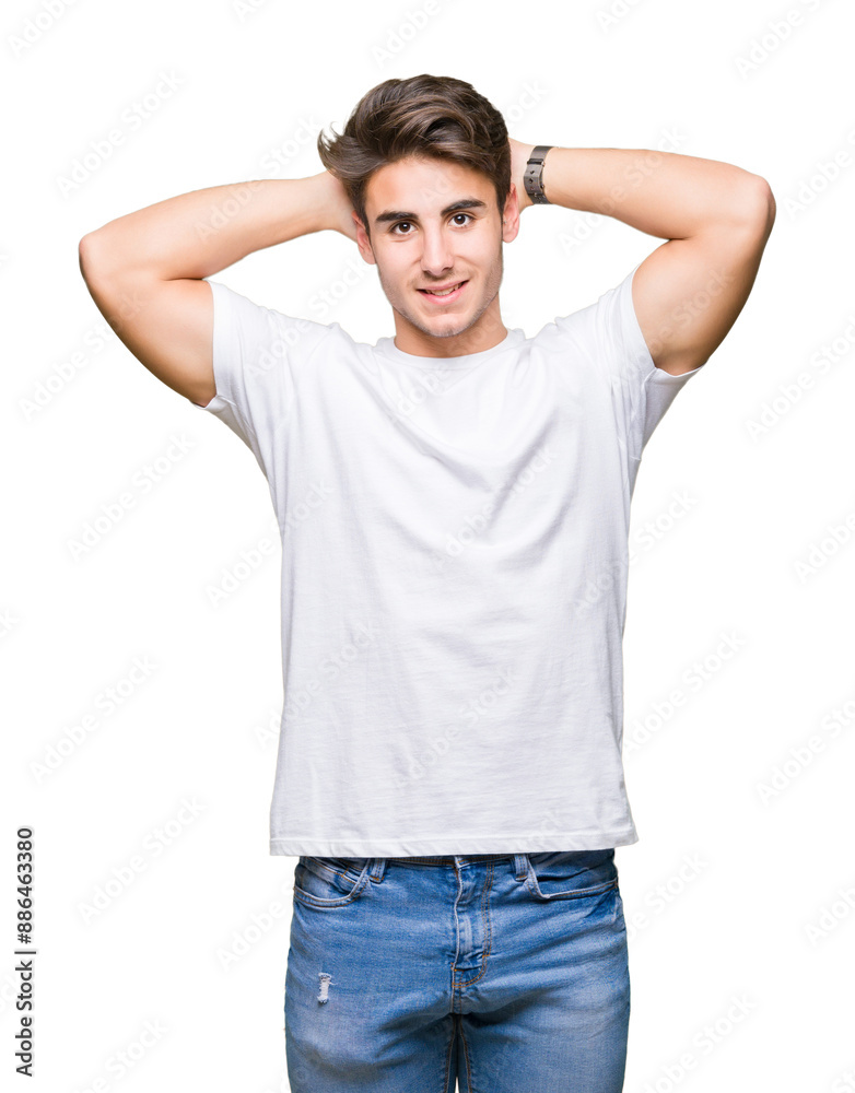 Young handsome man wearing white t-shirt over isolated background Relaxing and stretching with arms and hands behind head and neck, smiling happy Young handsome man wearing white t-shirt over isolated background Relaxing and stretching with arms and hands behind head and neck, smiling happy