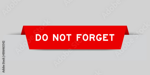 Red color inserted label with word do not forget on gray background
