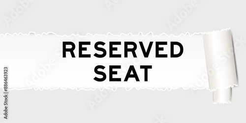 Ripped gray paper background that have word reserved seat  under torn part