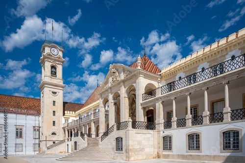 Historical of the University of Coimbra Portugal
 with a clock tower under a clear blue sky
