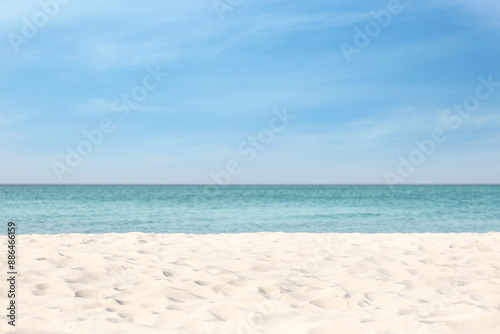 Beautiful sandy beach and sea on sunny day. Summer vacation