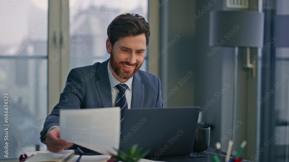 Creative startuper working laptop luxury workplace closeup. Man looking papers Creative startuper working laptop luxury workplace closeup. Man looking papers