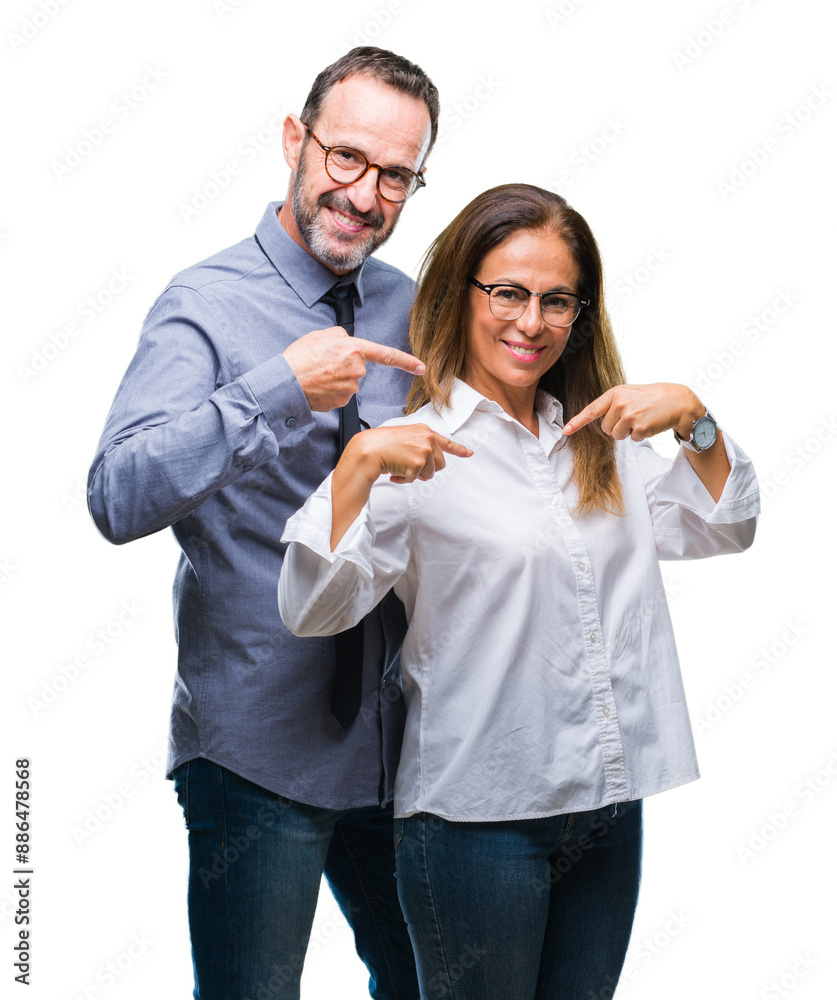 Middle age hispanic couple in love wearing glasses over isolated background looking confident with smile on face, pointing oneself with fingers proud and happy. Middle age hispanic couple in love wearing glasses over isolated background looking confident with smile on face, pointing oneself with fingers proud and happy.