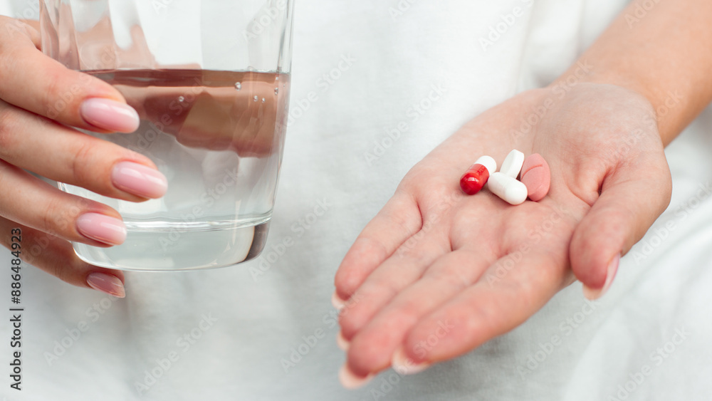 Medicine, pills and water in hands. Medical, drugs or person giving pharmaceutical supplements to drink as cure for pain of sick patient Medicine, pills and water in hands. Medical, drugs or person giving pharmaceutical supplements to drink as cure for pain of sick patient