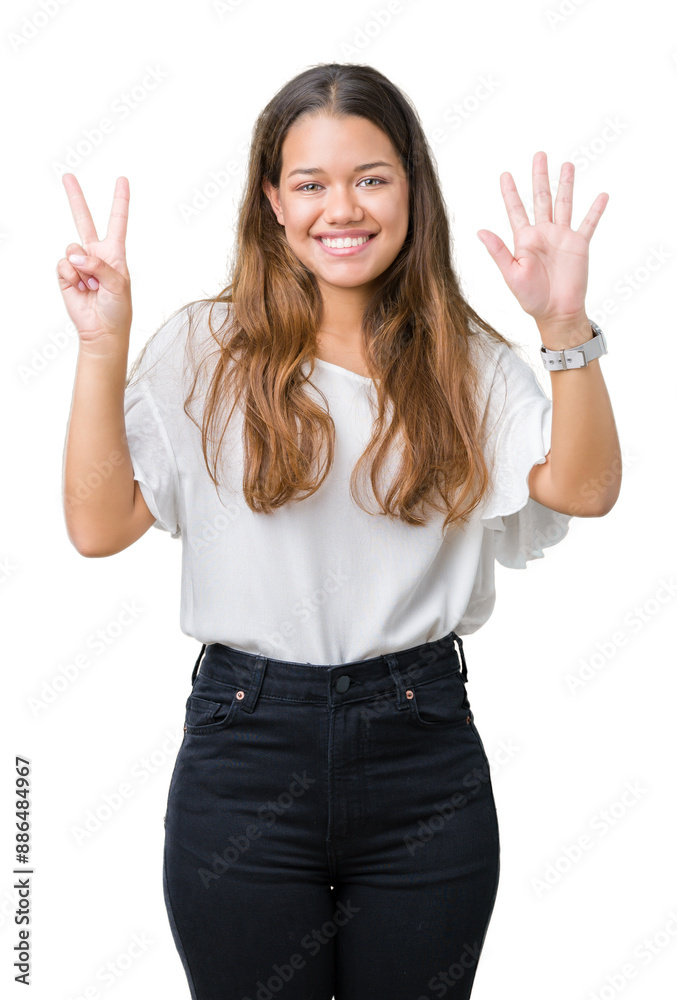 Young beautiful brunette business woman over isolated background showing and pointing up with fingers number seven while smiling confident and happy. Young beautiful brunette business woman over isolated background showing and pointing up with fingers number seven while smiling confident and happy.