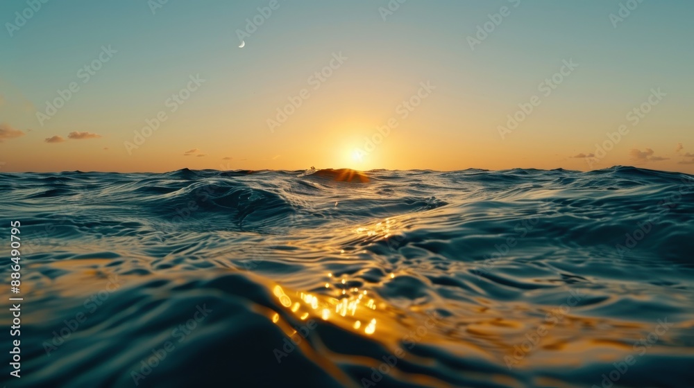 A breathtaking view of the sun setting over the ocean on a clear day, complemented by the appearance of a crescent moon rising, casting a serene and majestic ambiance. A breathtaking view of the sun setting over the ocean on a clear day, complemented by the appearance of a crescent moon rising, casting a serene and majestic ambiance.