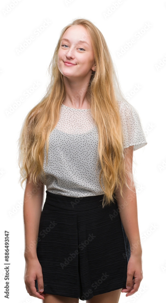 Blonde teenager woman wearing moles shirt smiling looking side and staring away thinking. Blonde teenager woman wearing moles shirt smiling looking side and staring away thinking.