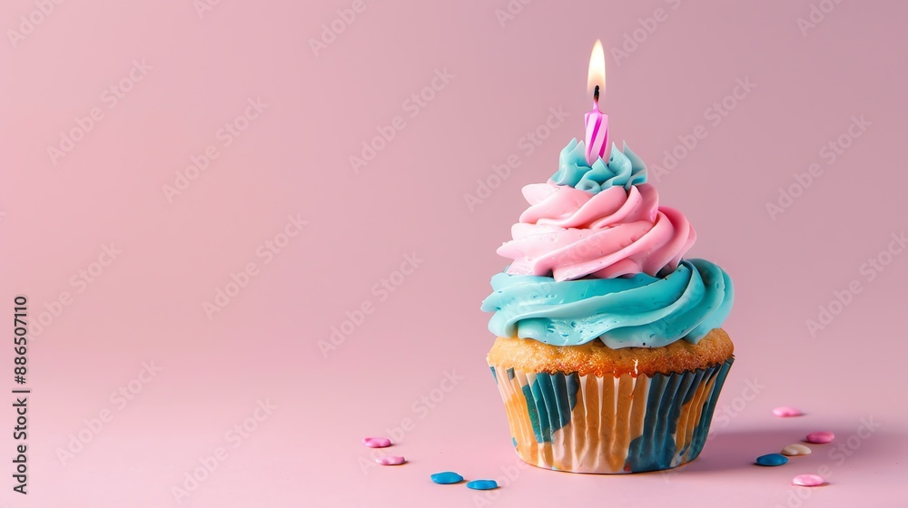 festive candle cupcake on a plain background with space for copying festive candle cupcake on a plain background with space for copying