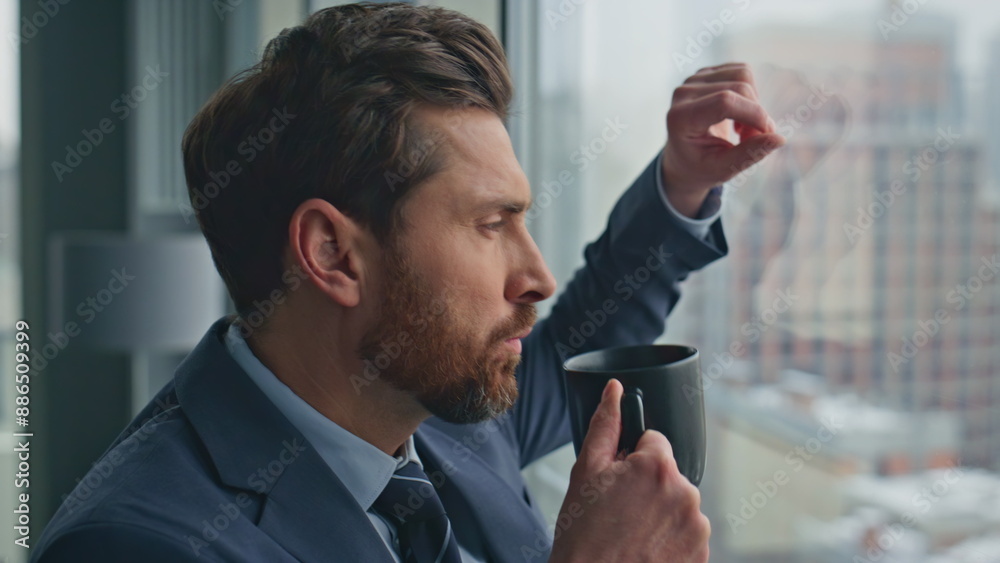 Naklejka premium Rich ceo drinking coffee watching cityscape at big window closeup. Boss relaxing