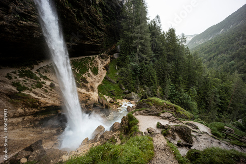 Perichnik waterfall is a beautiful drop from the mountain cliff, in Triglav National Park. Slovenian waterfall. Long for walking and trekking, enter inside the cave to admire it. Power and majesty.