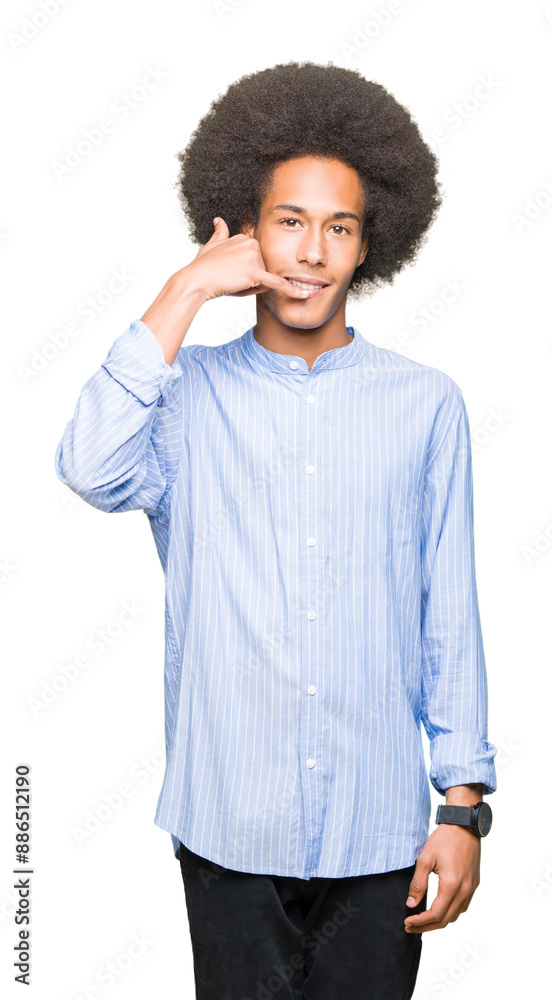 Young african american man with afro hair smiling doing phone gesture with hand and fingers like talking on the telephone. Communicating concepts. Young african american man with afro hair smiling doing phone gesture with hand and fingers like talking on the telephone. Communicating concepts.