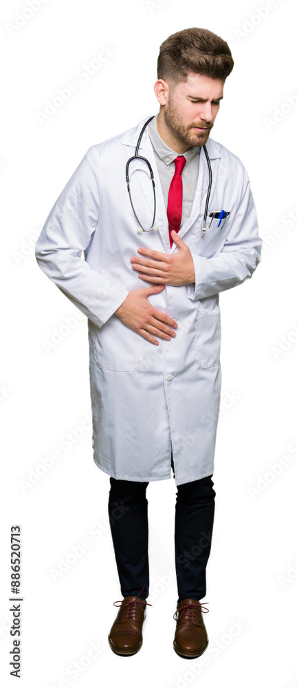 Young handsome doctor man wearing medical coat with hand on stomach because indigestion, painful illness feeling unwell. Ache concept. Young handsome doctor man wearing medical coat with hand on stomach because indigestion, painful illness feeling unwell. Ache concept.