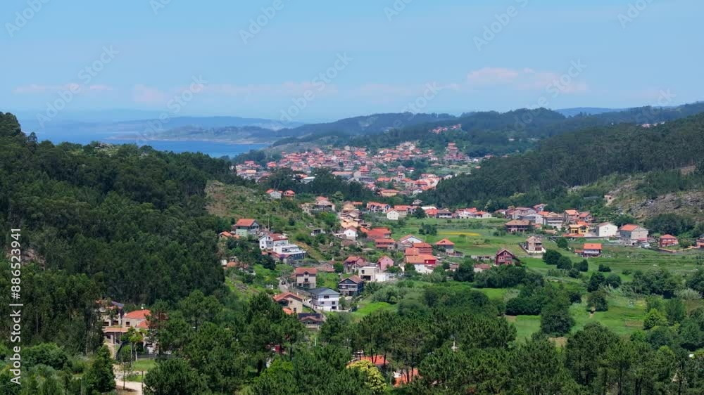 Remote Settlements Amidst Dense Mountains In Cangas, A Coruña Spain. Aerial Drone Shot Remote Settlements Amidst Dense Mountains In Cangas, A Coruña Spain. Aerial Drone Shot