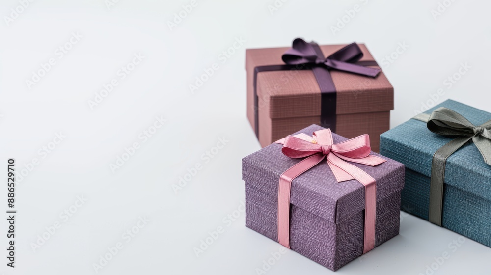 Elegant pastel-hued gift boxes with ribbons on minimalist background, perfect for celebrations, birthdays, or any special occasion. Elegant pastel-hued gift boxes with ribbons on minimalist background, perfect for celebrations, birthdays, or any special occasion.
