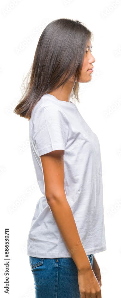 Young asian woman over isolated background looking to side, relax profile pose with natural face with confident smile. Young asian woman over isolated background looking to side, relax profile pose with natural face with confident smile.