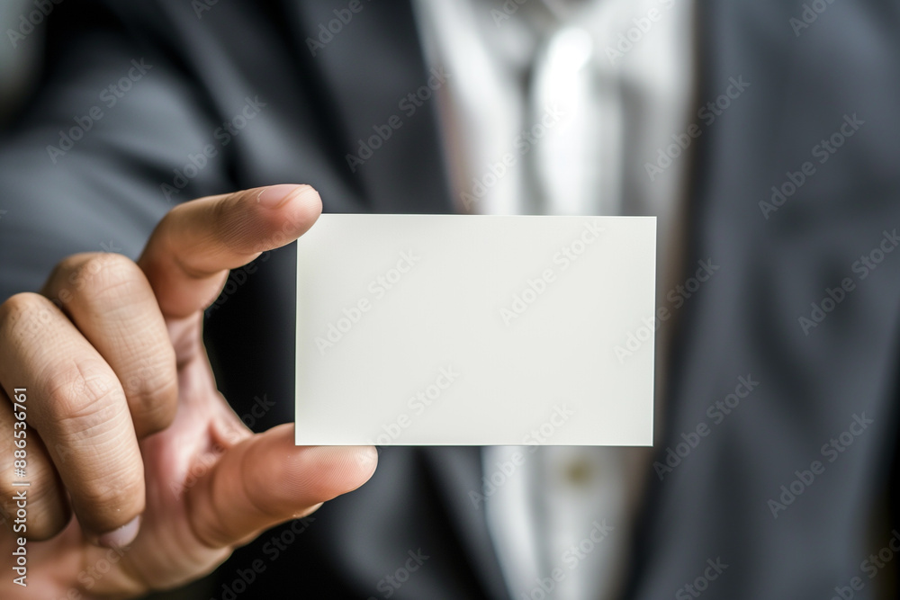 man hand holding a blank white business card for mock up man hand holding a blank white business card for mock up