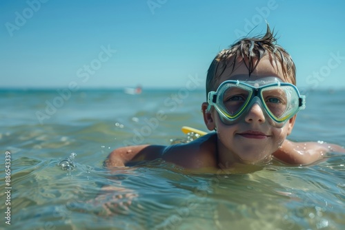 A boy swimming in the ocean on a bright sunny day, enjoying the natural surroundings and the refreshing water, with a distant boat visible in the background. © Milos
