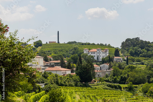 Dobrovo Castle nestled in the Slovenian vineyards near Nova Gorica and Cormons. Vineyards famous for Ribolla Gialla. Landscape and suggestive view of the castle in the distance. photo