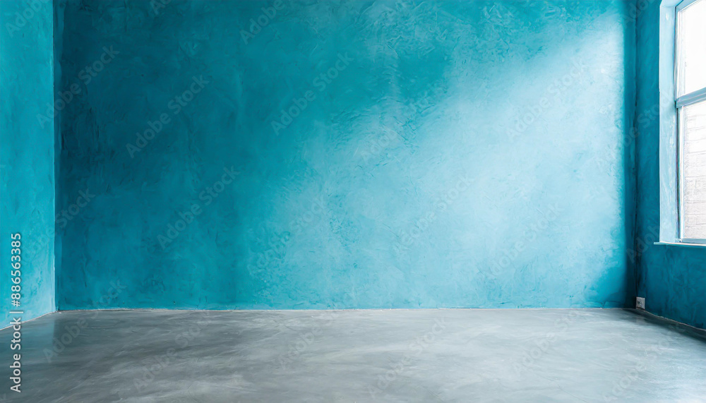 Blue wall in an empty room with concrete floor Blue wall in an empty room with concrete floor