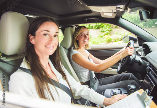 Vászonkép driver courses and people concept a car driving school instructor teaching young