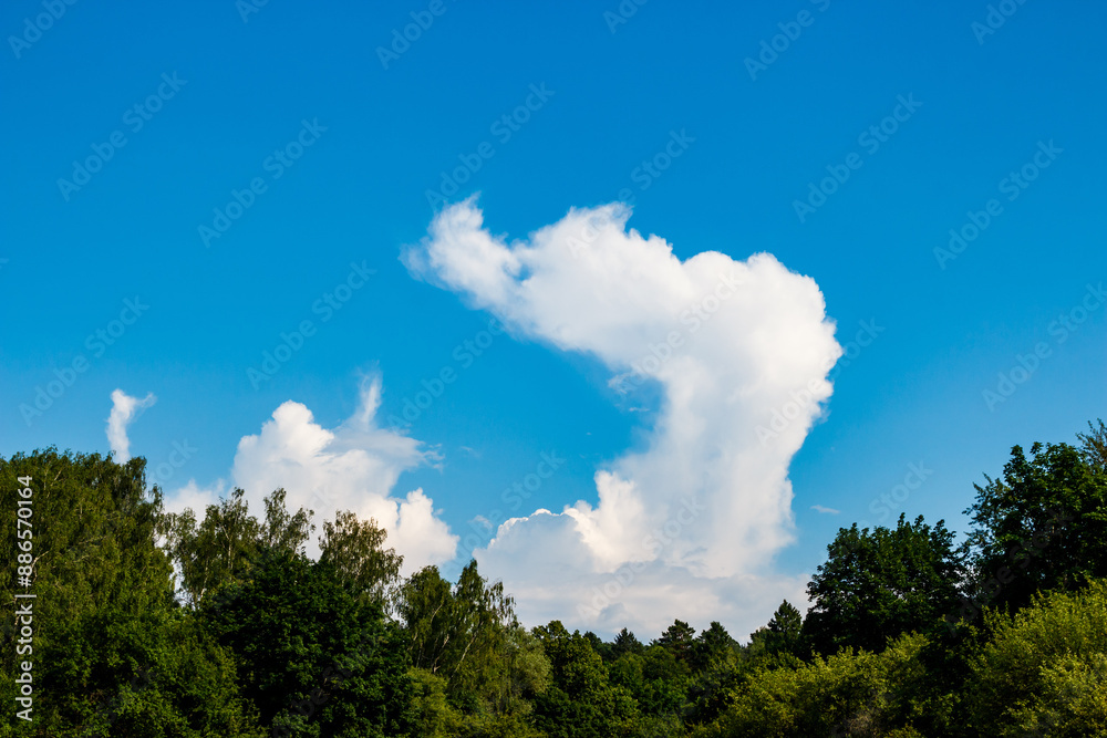 White cloud bent at an angle on a blue sky White cloud bent at an angle on a blue sky