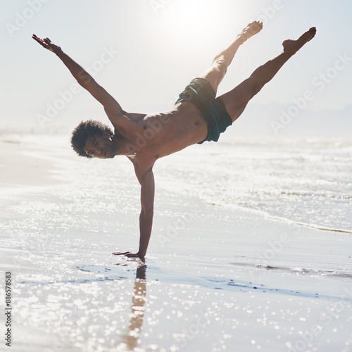 Dance, contemporary and man at beach with performance for choreography, acrobat or competition training. Body, sunshine and male person on shore for handstand, movement and routine in Jamaica