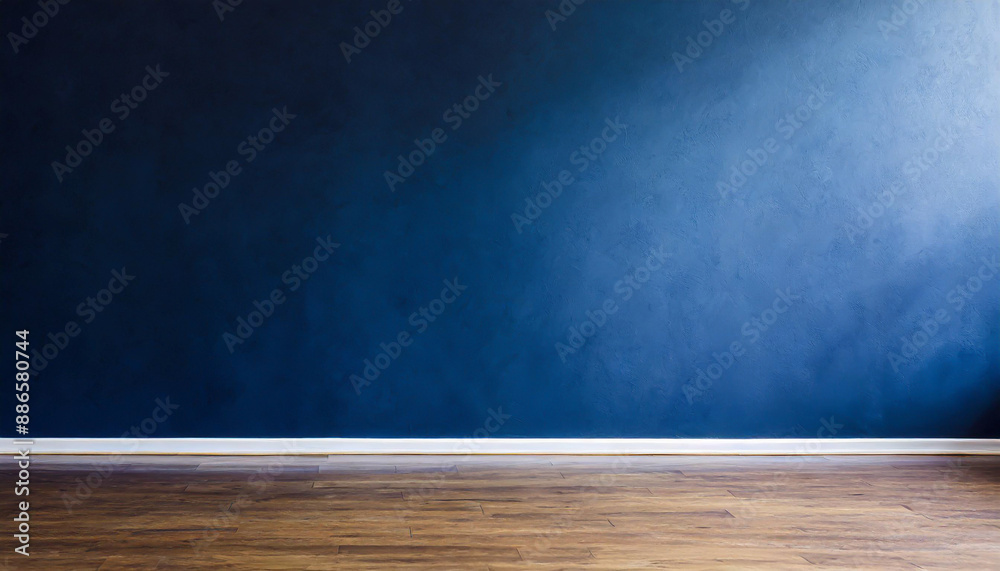 Dark blue wall in an empty room with a wooden floor Dark blue wall in an empty room with a wooden floor