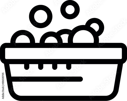 Laundry basket full of soap suds, ready for cleaning dirty clothes at home or in a laundromat