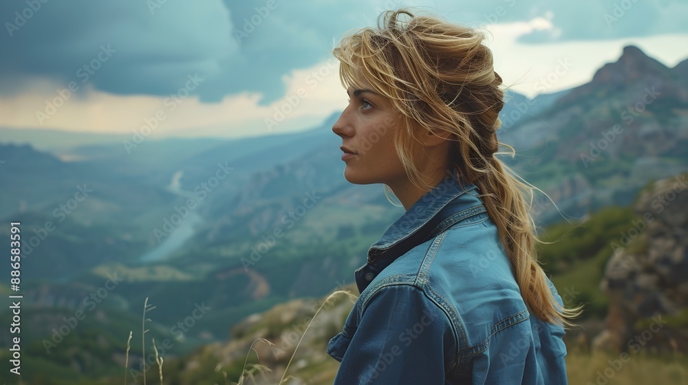 Naklejka premium Woman Contemplating the Scenic Mountain Vista with a Thoughtful Expression