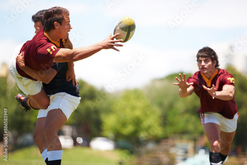 Rugby game, men and tackle during sport practice on a green field outdoors for fitness. Exercise, athlete and male people with teamwork and professional player with a workout in uniform