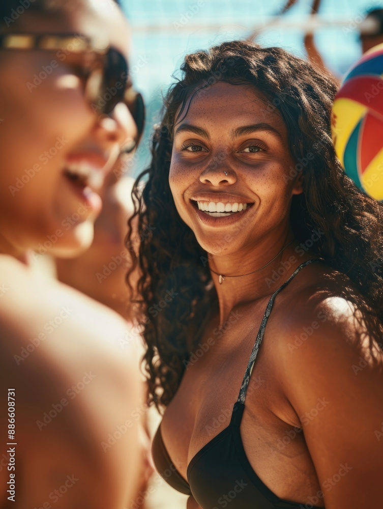 A happy woman wearing a bikini smiling directly at the camera A happy woman wearing a bikini smiling directly at the camera
