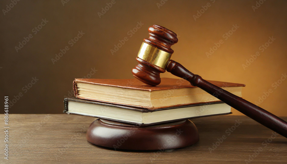 Wooden gavel and books on wooden table, law concept Wooden gavel and books on wooden table, law concept