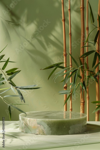 Smooth jade stone podium for product presentation on an Asian-inspired background with bamboo and soft lighting