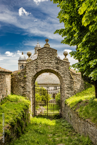 A glimpse of the ancient medieval village of Montefiascone, Viterbo, Italy. The Cathedral of Santa Margherita, with its large dome and the two bell towers, with clocks, on the sides.